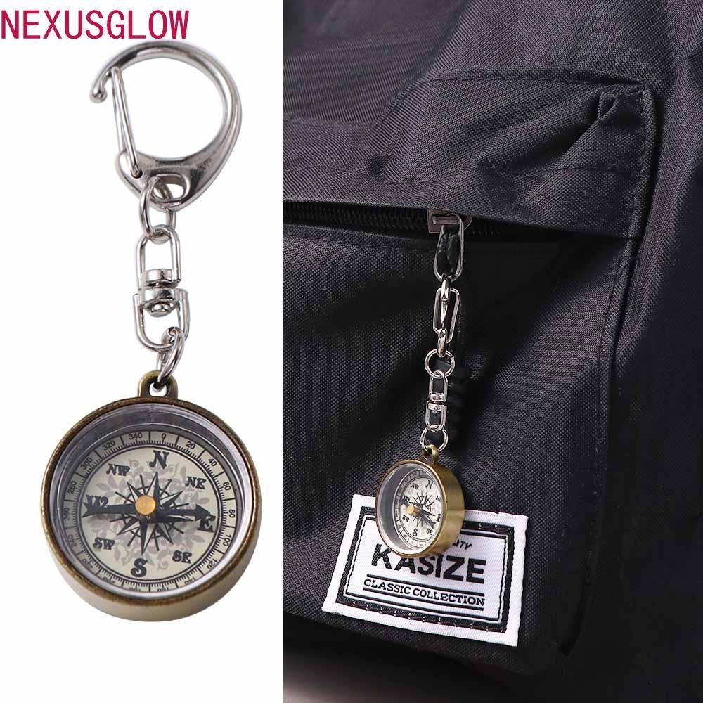 NEXUSGLOW เข็มทิศขนาดเล็ก Survival เดินป่าคุณภาพสูงพวงกุญแจจี้โลหะผสมสังกะสีเครื่องมือนาทางอุปกรณ์ปีนเขา Vintage Key Ring